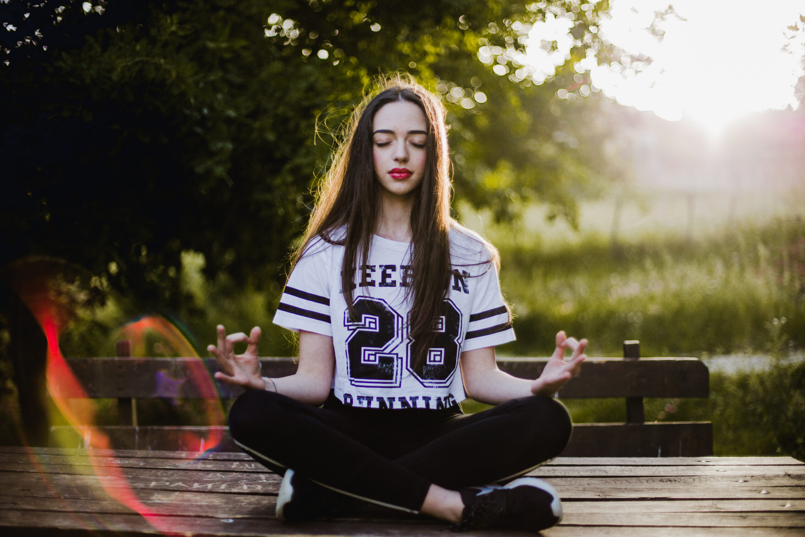 woman-meditating-table-park
